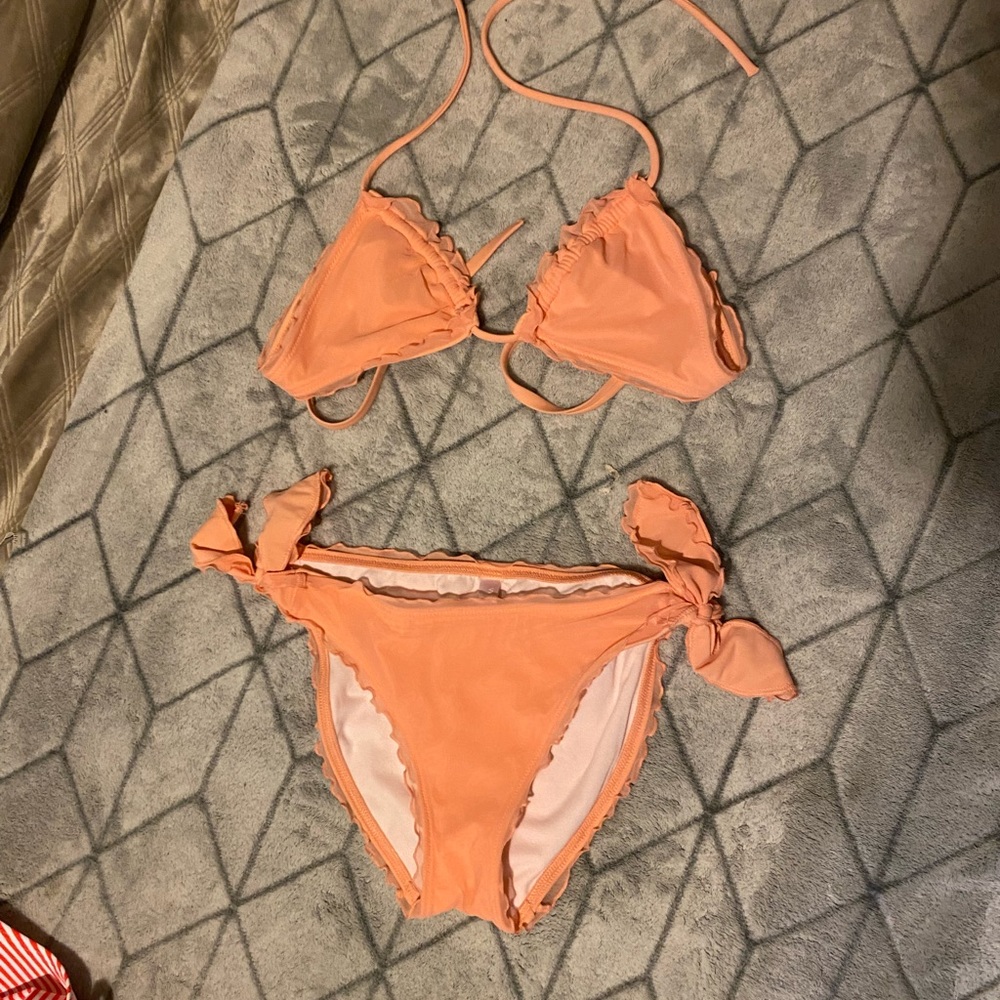 Peach colored ruffle edges bikini.